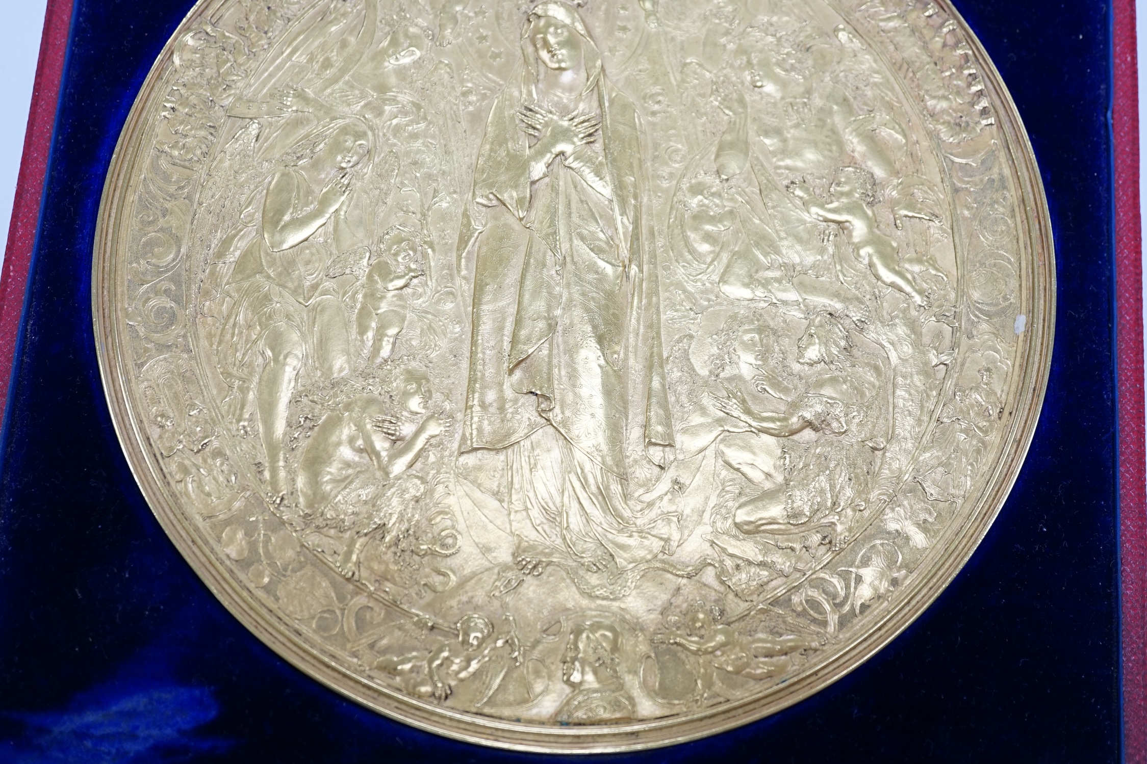 A Victorian pressed metal ormolu medallion of Mary as Queen of Heaven, 15.5cm, in a Hunt & Roskell fitted box